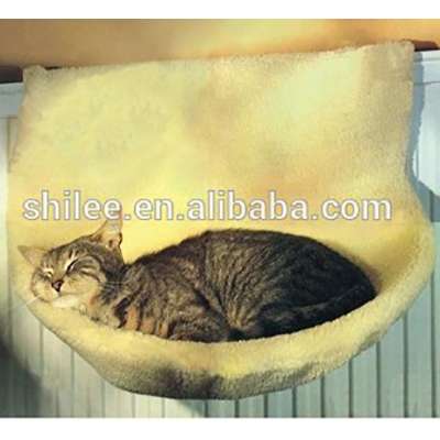 The Cat Hang Radia Bed On The Radiator Or Heater